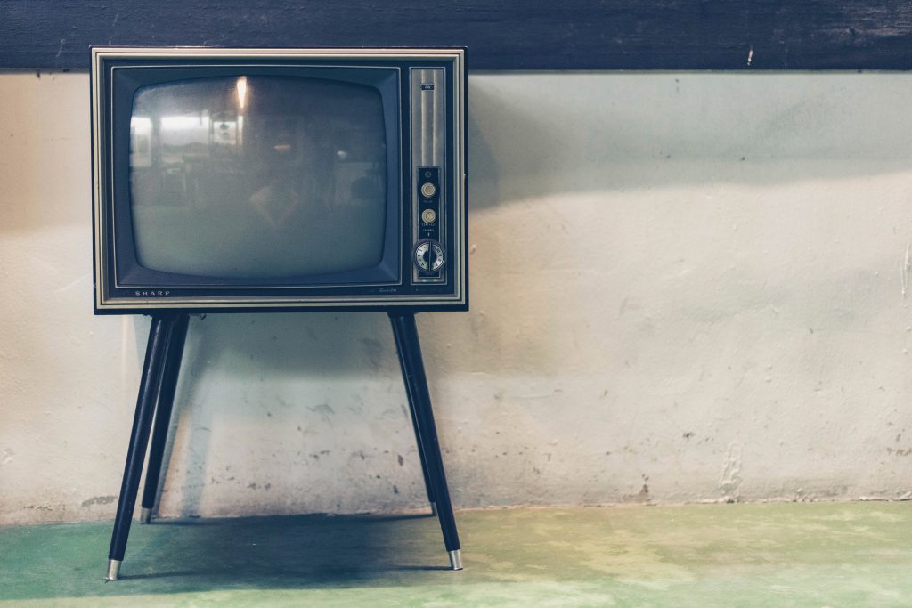 Old vintage television set in an empty room