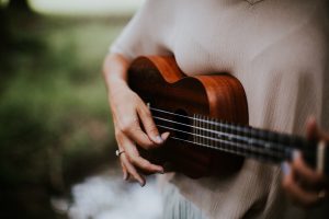 Woman playing a guitar