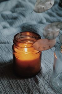 Candle light with a grey background.