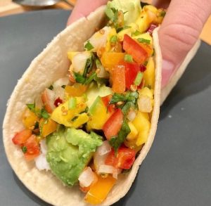 Fish taco being held