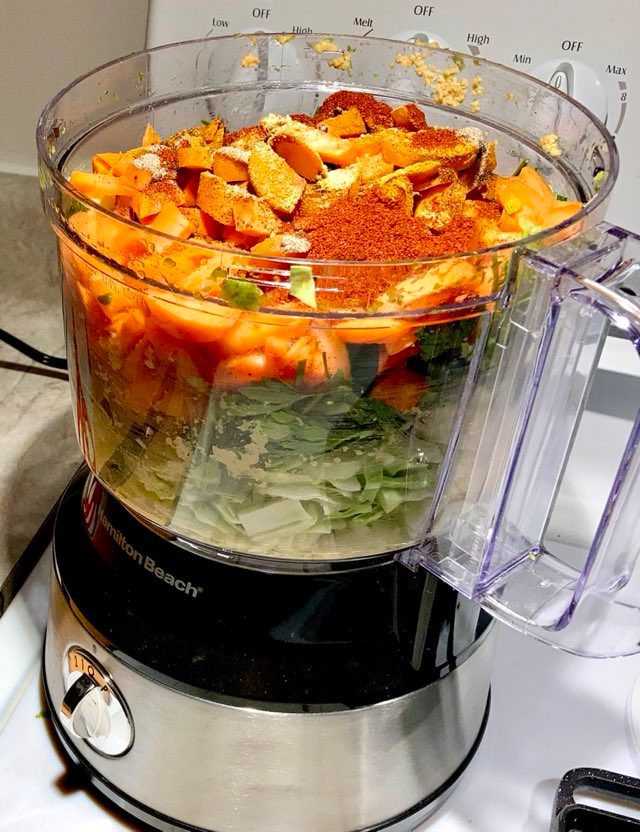 Food processor filled with vegetables